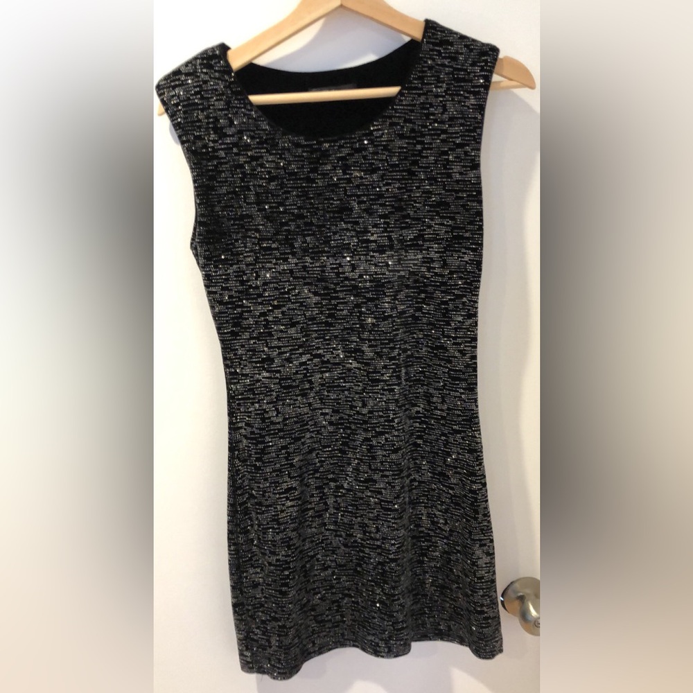 Black velour shimmery dress. Cute mini, has a slight padding in the shoulders.